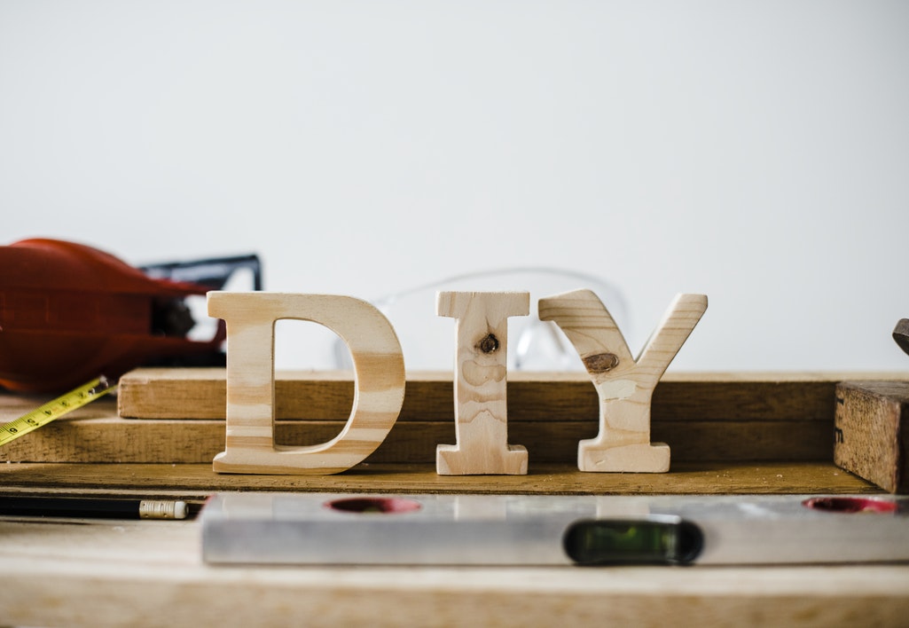 the word DIY in wooden letters